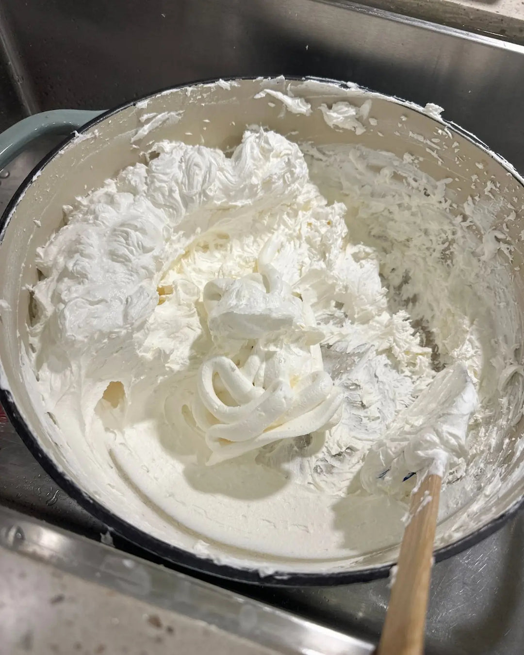 Tallow and Things rendered tallow moisturizer in a ceramic bowl with a wooden spoon