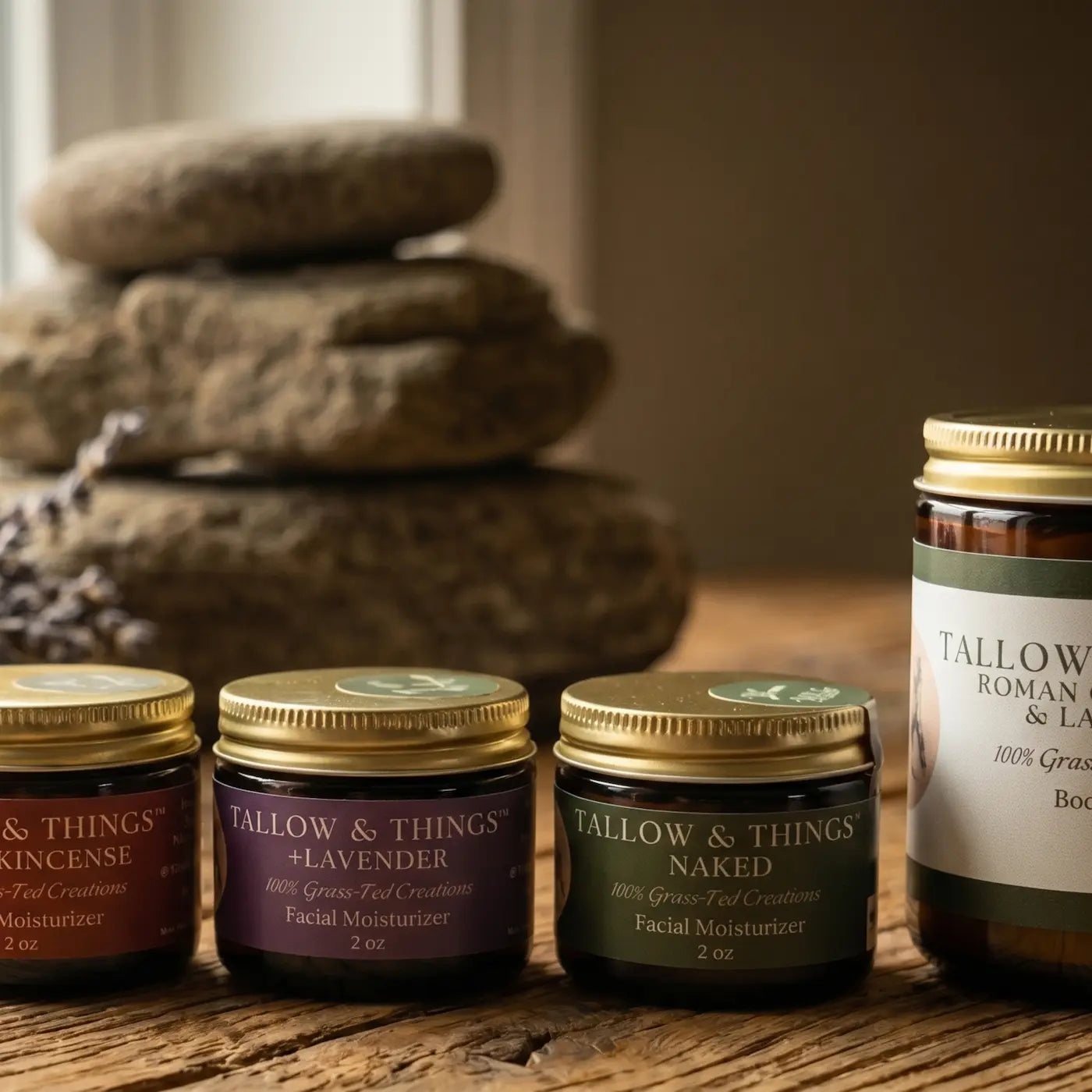 Tallow and Things grass-fed beef tallow skincare collection — frankincense, lavender, and unscented face moisturizers with body butter on rustic wood.