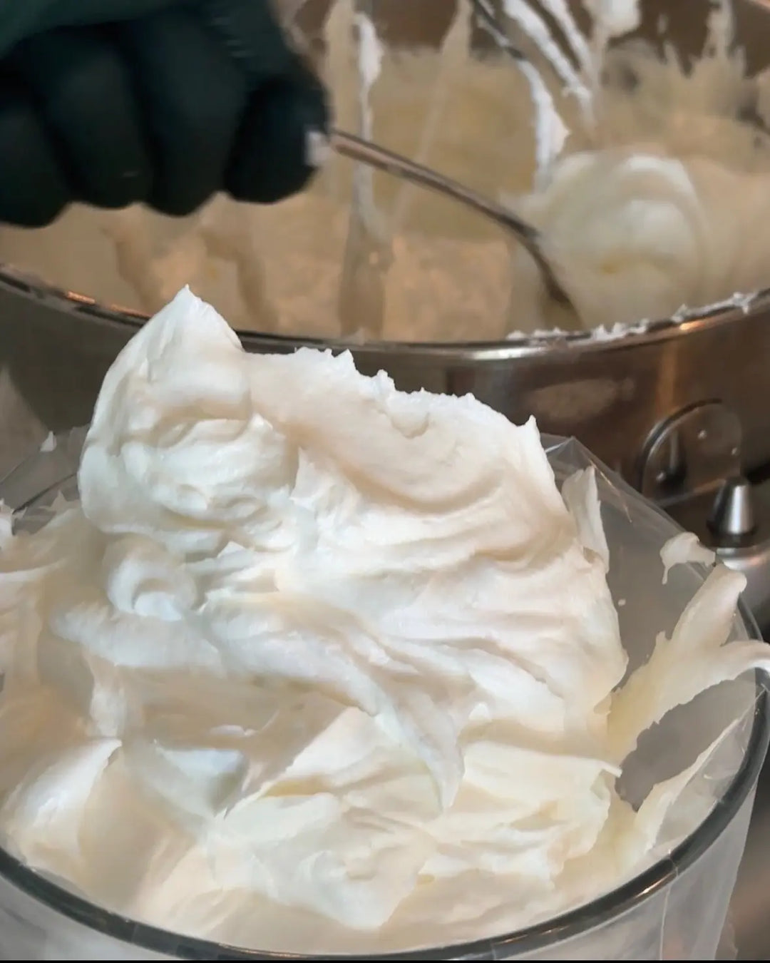 Whipped tallow forming a soft fluffy peak beside a stand mixer